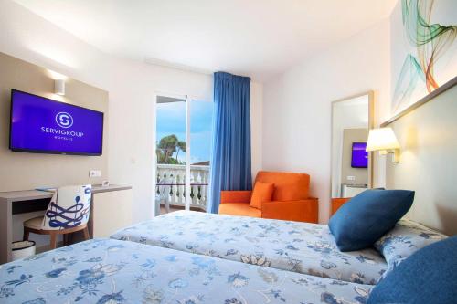 Postel nebo postele na pokoji v ubytování Hotel Servigroup Romana