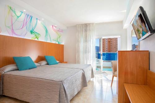 Una cama o camas en una habitación de Hotel Servigroup Castilla