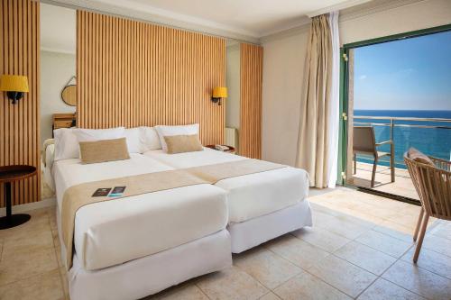 Ένα ή περισσότερα κρεβάτια σε δωμάτιο στο Hotel Servigroup Montíboli