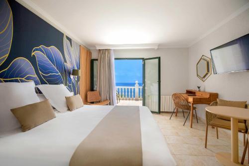 Ένα ή περισσότερα κρεβάτια σε δωμάτιο στο Hotel Servigroup Montíboli