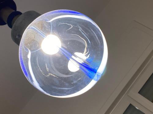 a glass light with two tooth brushes in it at La VILLA REGAL in Brescia
