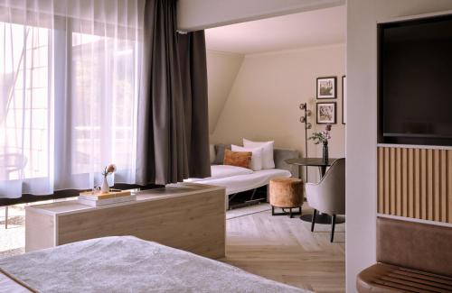 Ένα ή περισσότερα κρεβάτια σε δωμάτιο στο Leonardo Royal Hotel Baden- Baden