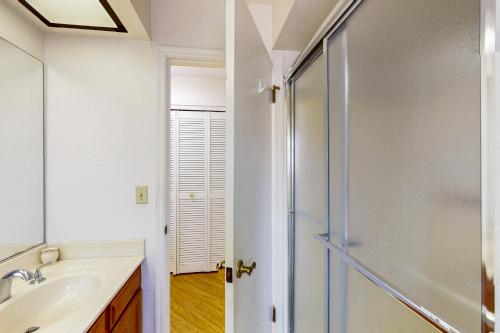 a bathroom with a shower and a sink at At Your Leisure in Mesa
