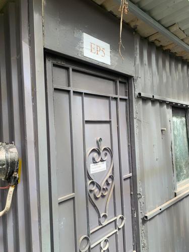a door with a heart on the side of a building at Chill Door Homestay in Ấp Long Ðại