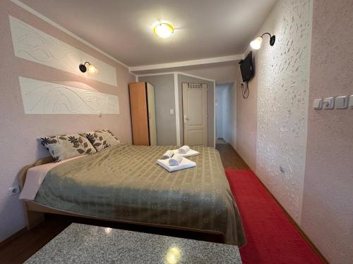 Postel nebo postele na pokoji v ubytování Apartmani 4