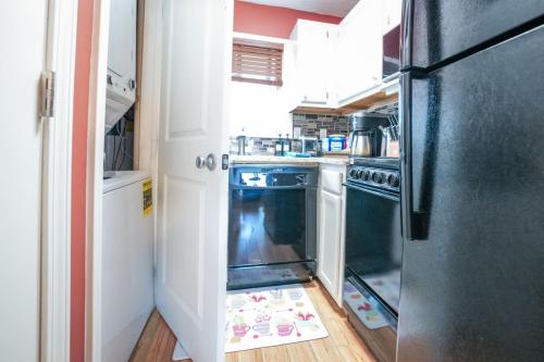 a kitchen with a refrigerator with its door open at First floor, Studio, Resort Access, Portable AC in Beech Mountain