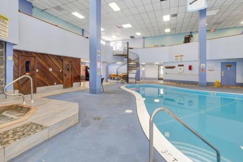 a large swimming pool in a building at First floor, Studio, Resort Access, Portable AC in Beech Mountain