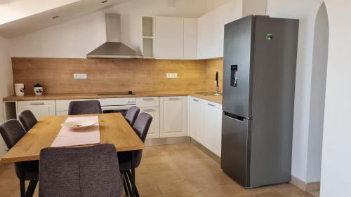 Η κουζίνα ή μικρή κουζίνα στο Apartments NewWay Bol