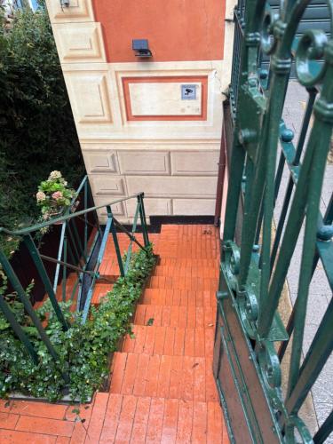 a brick walkway leading to a building with a door at B&B Ladidi in Rapallo