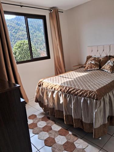 Ένα ή περισσότερα κρεβάτια σε δωμάτιο στο Apartamento na serra