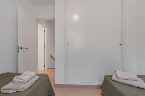 Ένα ή περισσότερα κρεβάτια σε δωμάτιο στο Infinity View Apartment Menorca