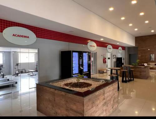 a store with a large lobby with a largeitialized at Loft aconchegante com varanda Campolim in Sorocaba