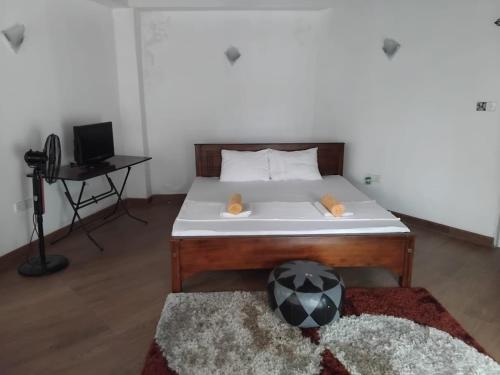 Ένα ή περισσότερα κρεβάτια σε δωμάτιο στο Hewune Uptown Stay