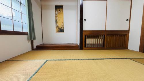 an empty room with a rug on the floor at SecondHouse Green in Otaru