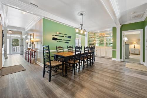 a dining room with a table and chairs at Ruthie's Roost villa by Peace Vacations in Georgetown