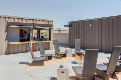 a group of chairs sitting on top of a patio at RESET Hotel Joshua Tree in Twentynine Palms