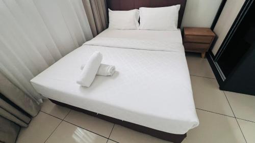 Ένα ή περισσότερα κρεβάτια σε δωμάτιο στο Trion KL Premium Residence
