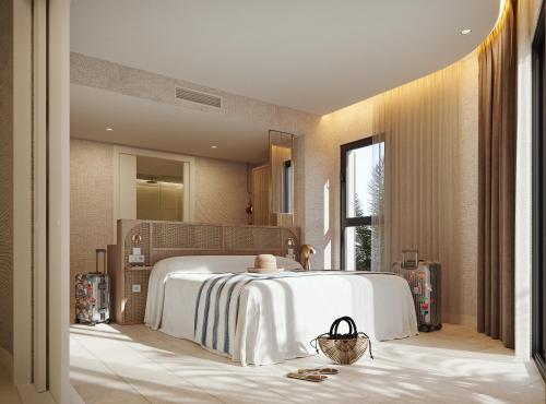 a bedroom with a large white bed and a window at Hotel Vibra Yamm Sunset -New Opening 2025 in San Antonio