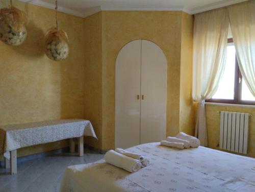 Una cama o camas en una habitación de Casa Irisviola
