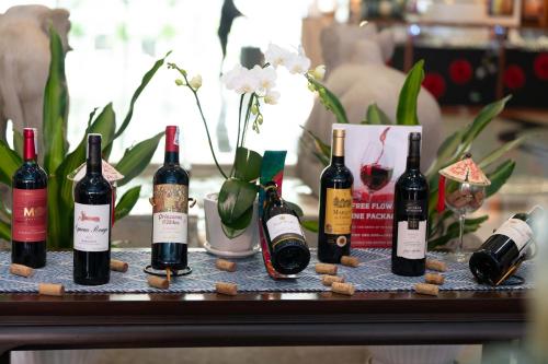 a group of bottles of wine sitting on a table at Garden Plaza Saigon - Formerly PARKROYAL Saigon in Ho Chi Minh City
