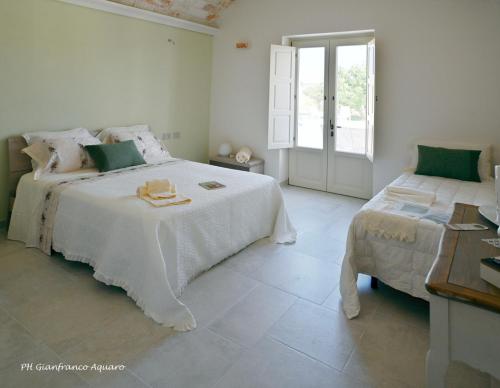 Postel nebo postele na pokoji v ubytování Villa Itriò - In the heart of Apulia - B&B - pool - rural experience