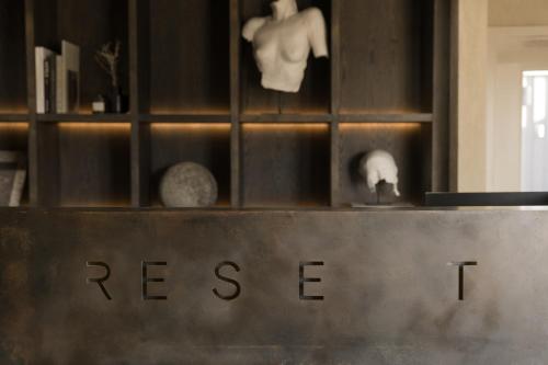 a sign that says rescue on a shelf with skulls at RESET Hotel Joshua Tree in Twentynine Palms