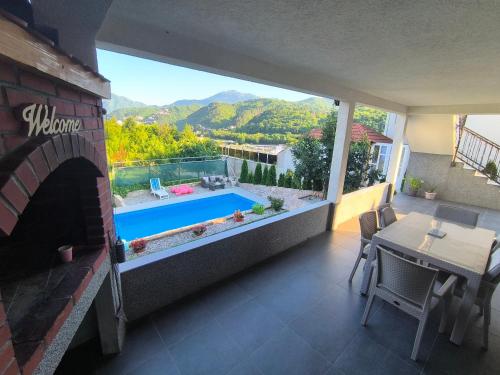 a balcony with a view of a swimming pool at Vila Đul in Konjic