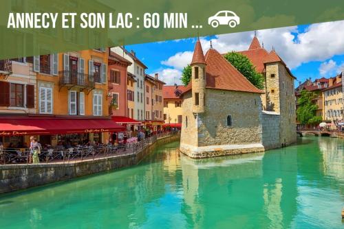 a view of a river in a city with buildings at Chez Fred 202 - Parking Wifi Balcon in Saint-Pierre-dʼAlbigny