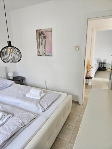 Katil atau katil-katil dalam bilik di Mala Smokva Apartments Vir Prezida