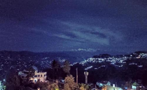 a view of a city at night at Mountain View Hillside Homestay Kalimpong, Between Silk Route- Deolo Park- Ramdhura in Kalimpong