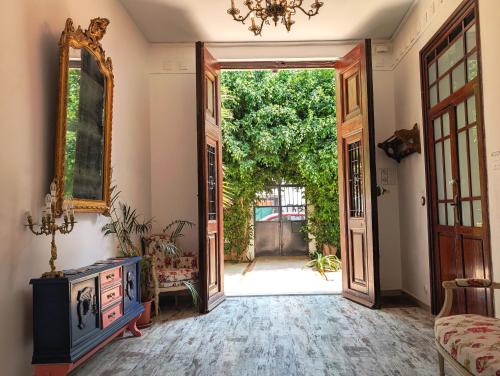 an open door into a room with an open doorway at Portrait Boutique Guesthouse in Valencia
