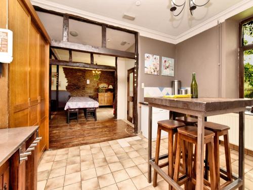 a kitchen with a bar and a living room at Lierneux Forest View Lodge in Lierneux