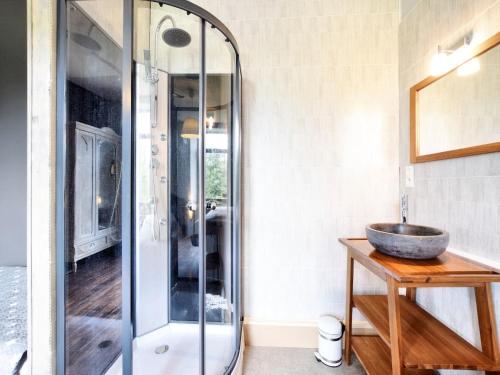 a bathroom with a glass shower and a sink at Lierneux Forest View Lodge in Lierneux
