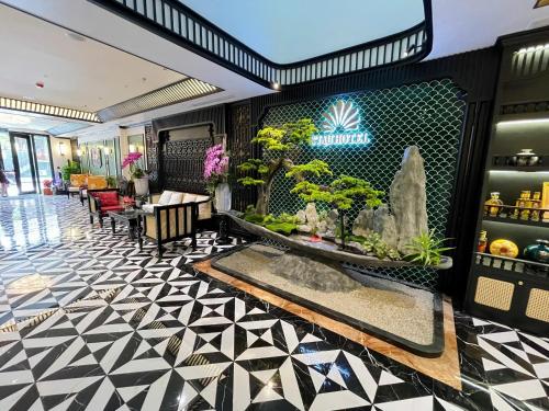 a lobby of a hotel with at C'Lau Hotel Ninh Binh in Ninh Binh