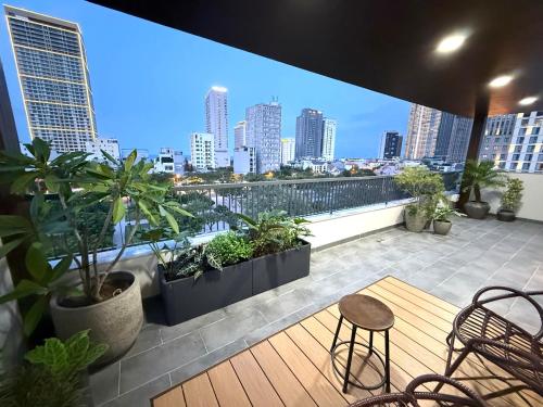 a balcony with a view of a city skyline at Sam Hotel & Apartment Da Nang in Da Nang