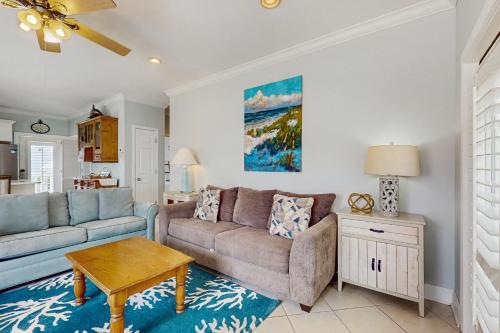 a living room with a couch and a table at Molokai Villas 5B in Pensacola
