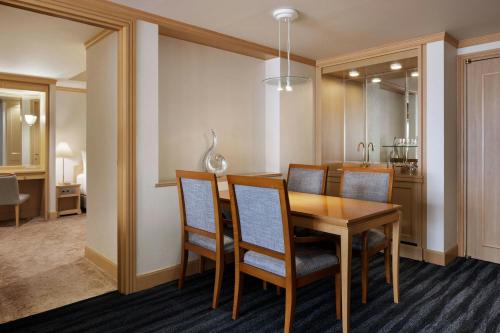 a dining room and kitchen with a table and chairs at Fairfield by Marriott Sapporo in Sapporo