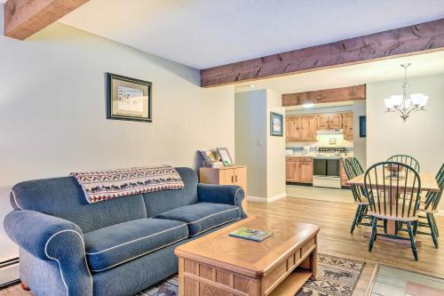 a living room with a couch and a table at 1 Mi to Attitash Mountain Condo with Resort Perks in Bartlett