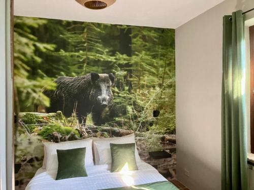 a bedroom with a bed with a picture of a sheep at Casavabene in Murazzano