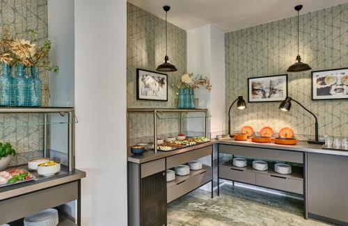 a room with shelves with food on them at Leonardo Hotel Muenchen City West in Munich