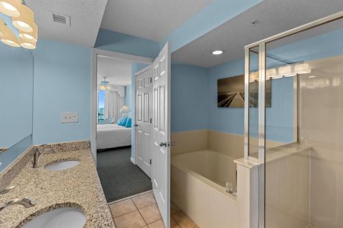 a bathroom with two sinks and a shower at Ashworth 1709 in North Myrtle Beach