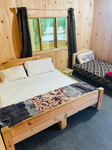 Postel nebo postele na pokoji v ubytování Amir Guest House Taobat