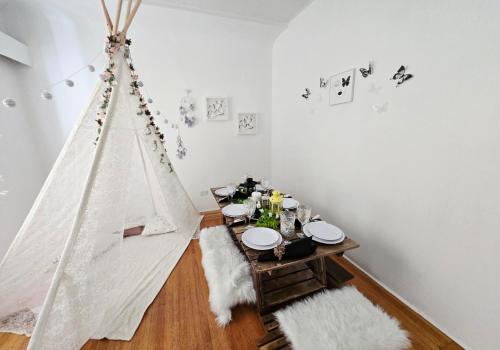 a dining room with a table and a tent at Private Airconditioned 2 Bedroom Home Private Parking in Burnaby