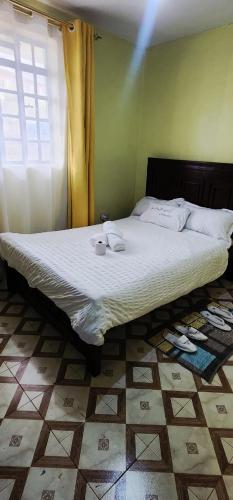 Una cama o camas en una habitación de Ndune Homes