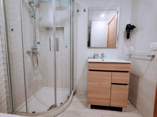 a bathroom with a shower and a sink at ESTUDIO DEBORA in Playa Fañabe