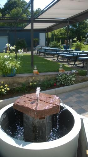 a fountain in the middle of a park at Pension Margarethe in Biedenkopf