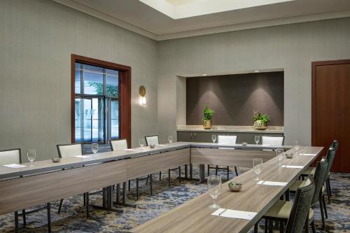a conference room with a long table and chairs at JW Marriott Grand Rapids in Grand Rapids