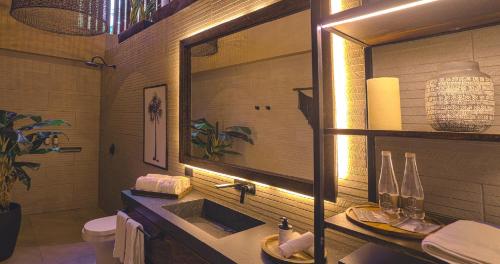 a bathroom with a sink and a mirror at Hotel Casa Candela in San Jerónimo