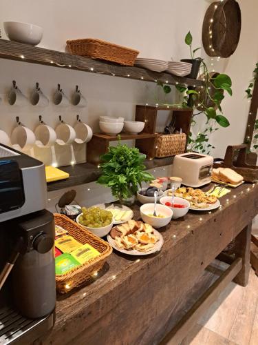 a buffet with many plates of food on a table at Agriturismo Borgo del Canto in Borghetto dʼArroscia