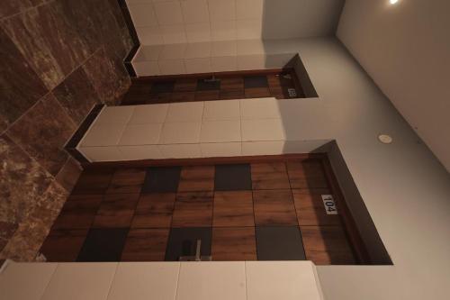 an overhead view of a room with a tile floor at I grand Home Stay in Tallākulam